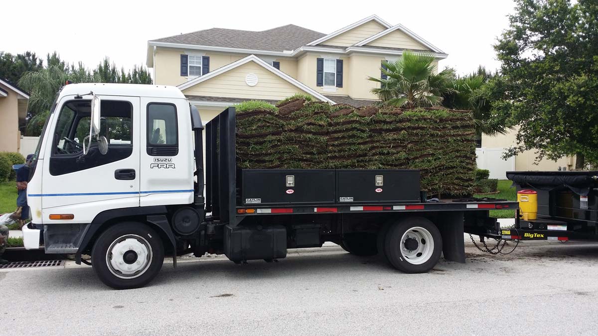 The Daniels Landscape & Irrigation LLC truck with a bed full of sod