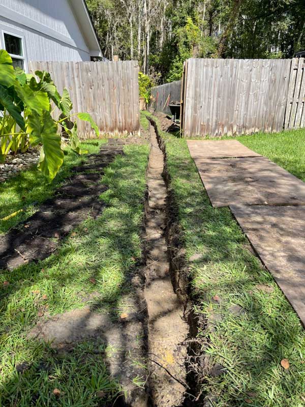 A trench excavated so an irrigation system can be installed