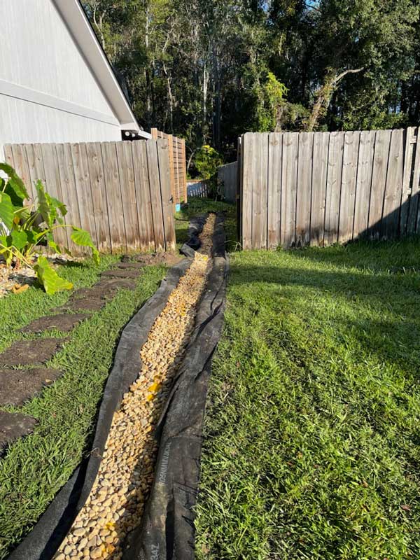 Filling a ditch with round rock