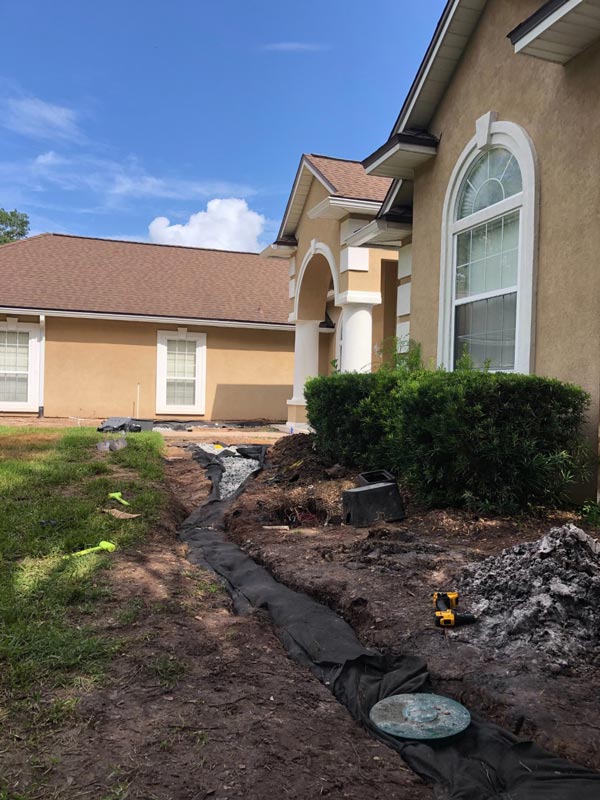 In-progress photo of French drain installation