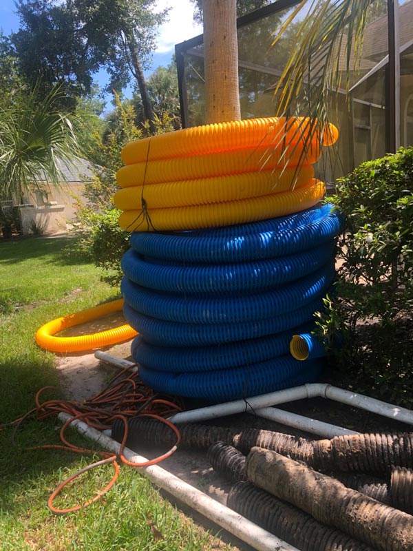Corrugated pipes, ready to be used in a French drain installation