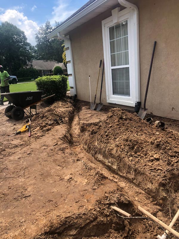 A trench, ready for a French drain installation