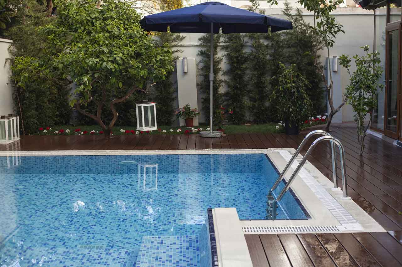 In-ground pool with wooden deck
